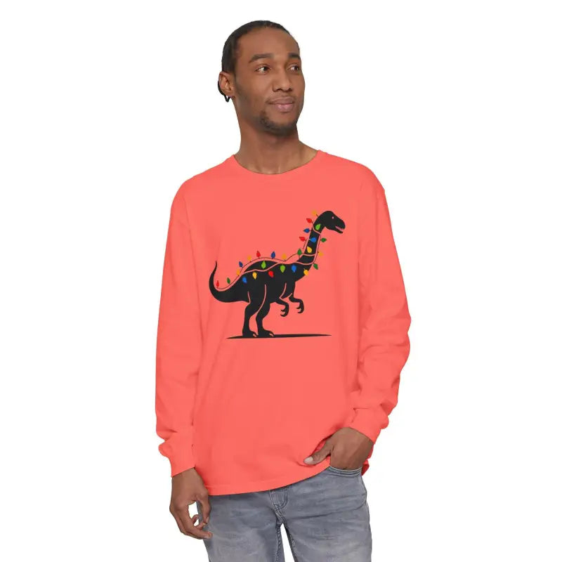 Coral long-sleeved shirt featuring a festive dinosaur graphic for Christmas
