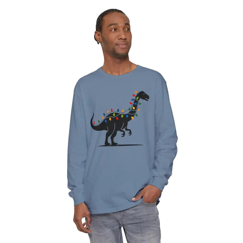 Blue long-sleeved shirt featuring a dinosaur adorned with Christmas lights