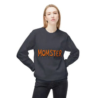 Woman wearing a dark gray crewneck sweatshirt with MOMSTER dripping orange letters