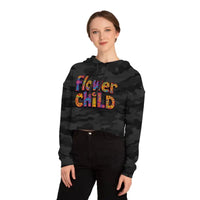 Woman wearing Flower Child Cropped Hoodie in Pastel Floral Print with black camouflage crop hoodie and black pants