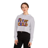 Woman wearing a light gray Flower Child Cropped Hoodie with colorful Flower Child text