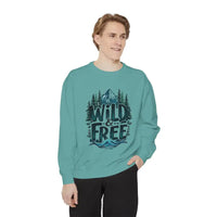 Light blue crewneck sweatshirt with mountain, tree, wave graphic and WILD & FREE text