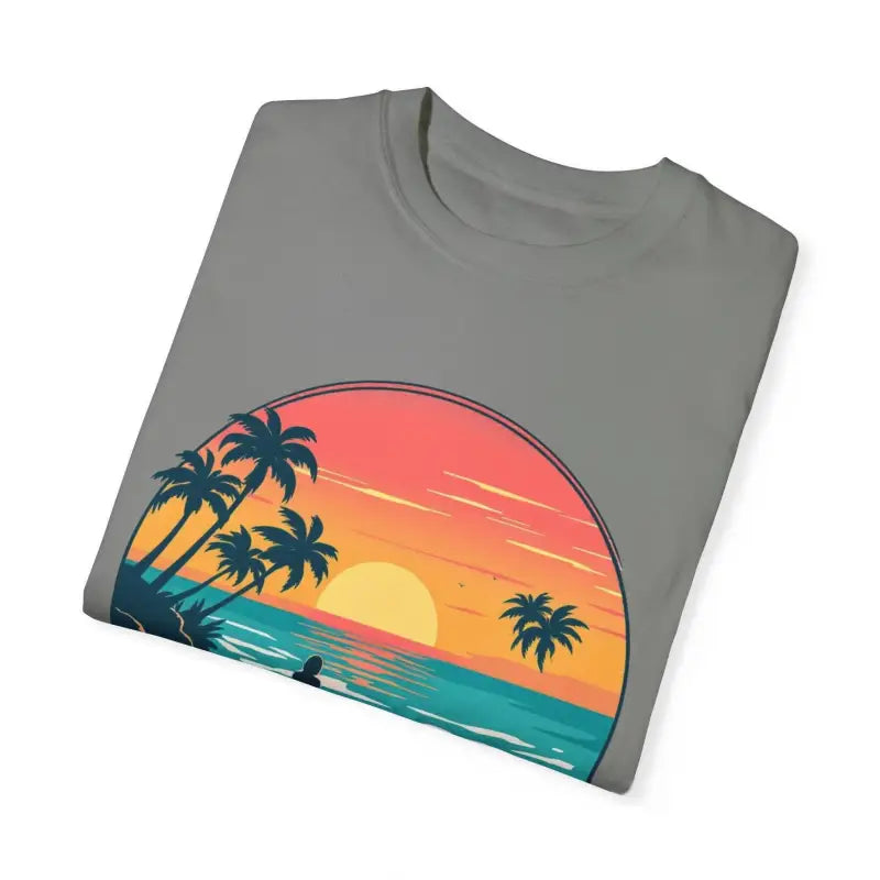 Folded gray t-shirt featuring sunset beach graphic from Suns Out Buns Out collection