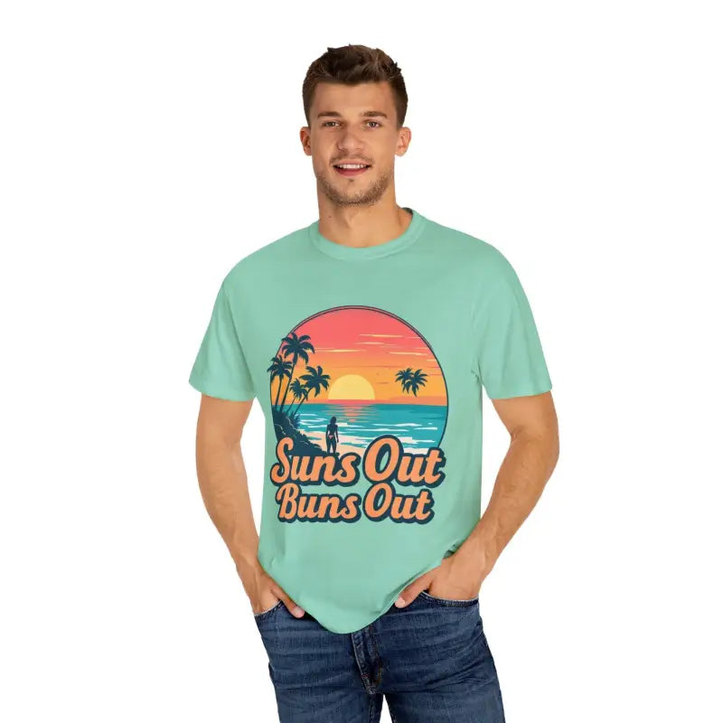 Man wearing Suns Out Buns Out Unisex Garment Dyed Summer T Shirt in casual setting