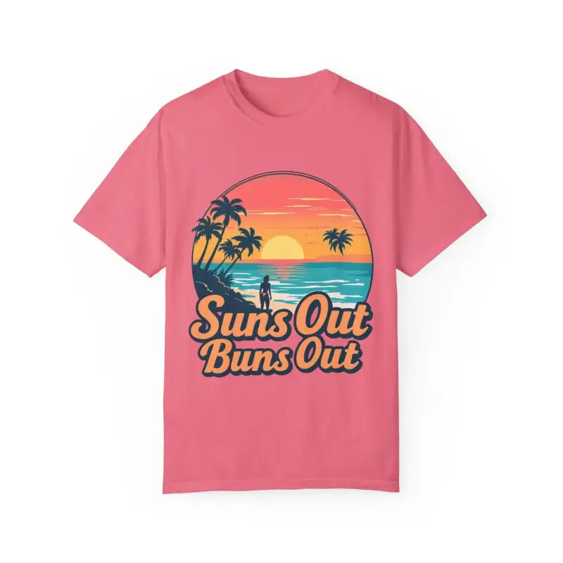 Pink t-shirt featuring a beach graphic from the Suns Out Buns Out collection
