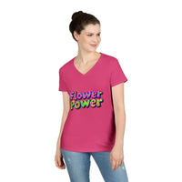 Woman wearing a pink V-neck Flower Power T-shirt and blue jeans