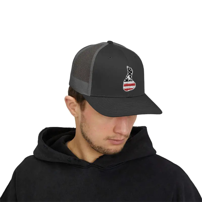Gray trucker hat featuring an American flag-shaped embroidered patch