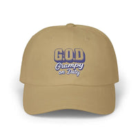 Tan baseball cap with G.O.D. Grampy on Duty in blue and white lettering