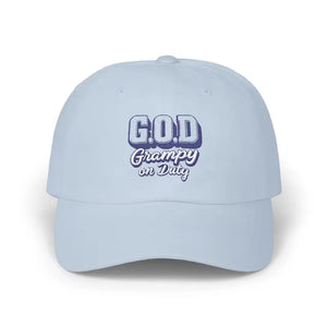 Light blue baseball cap with G.O.D. Grampy on Duty in purple and white lettering