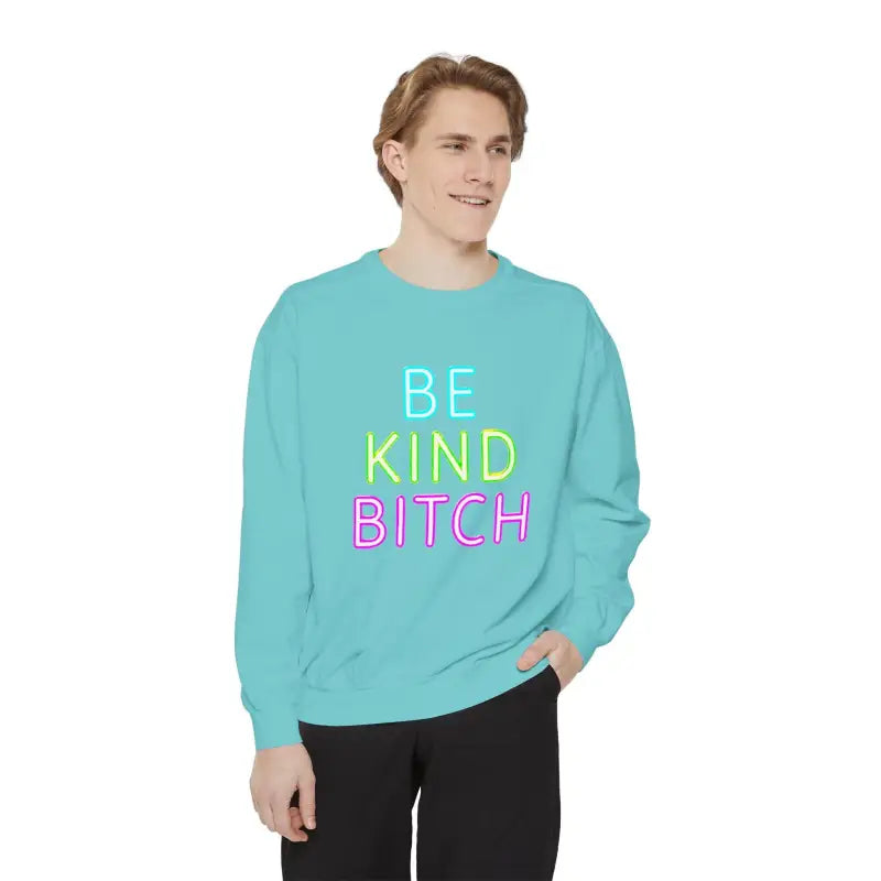 Turquoise Be Kind Unisex Sweatshirt featuring vibrant colorful text design