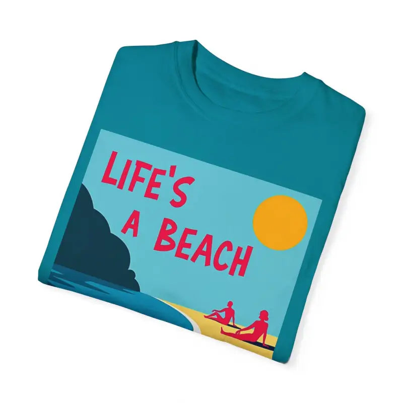 Teal Beach Life Unisex T Shirt featuring a vibrant beach graphic design