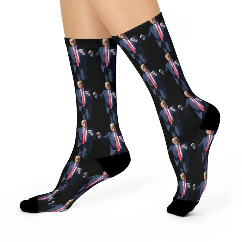 Black athletic socks with repeating Donald Trump suit pattern