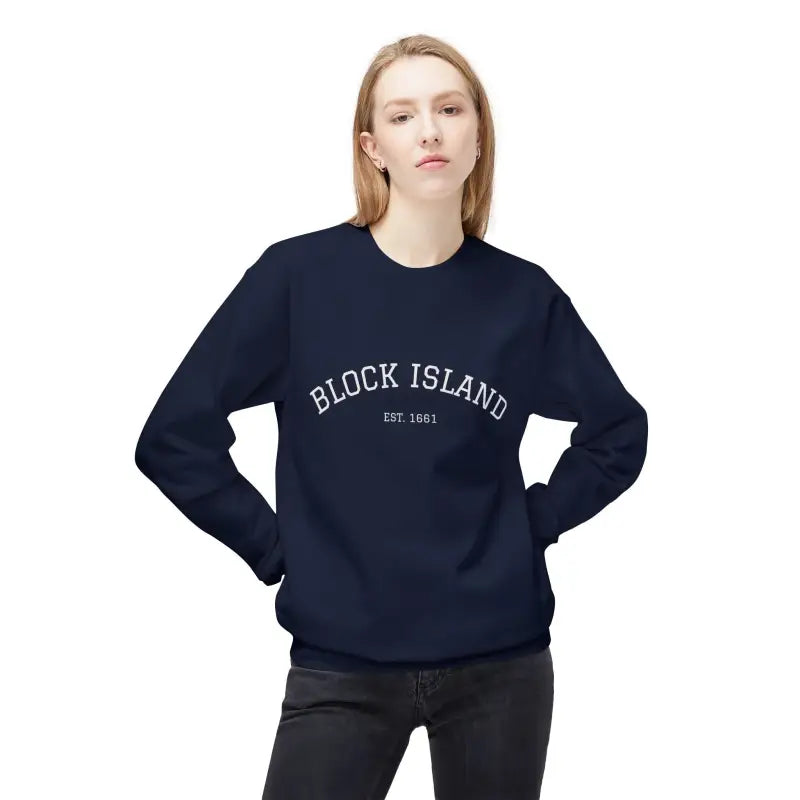 Woman wearing navy blue Block Island EST 1661 long-sleeve sweatshirt and dark pants