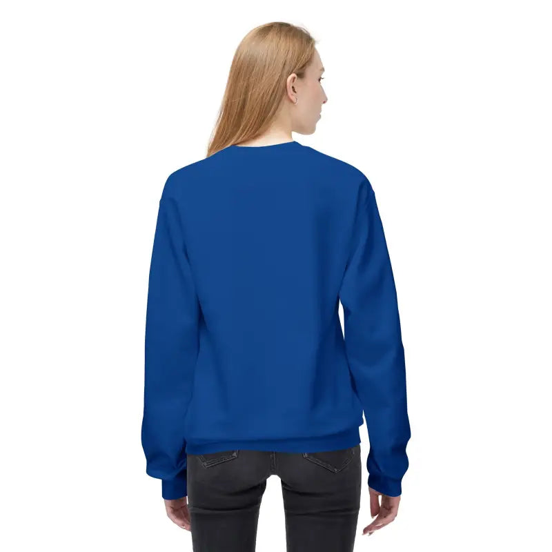 Woman wearing a royal blue crew-neck sweatshirt and dark-wash jeans showcasing the Block Island Crewneck Sweatshirts collection