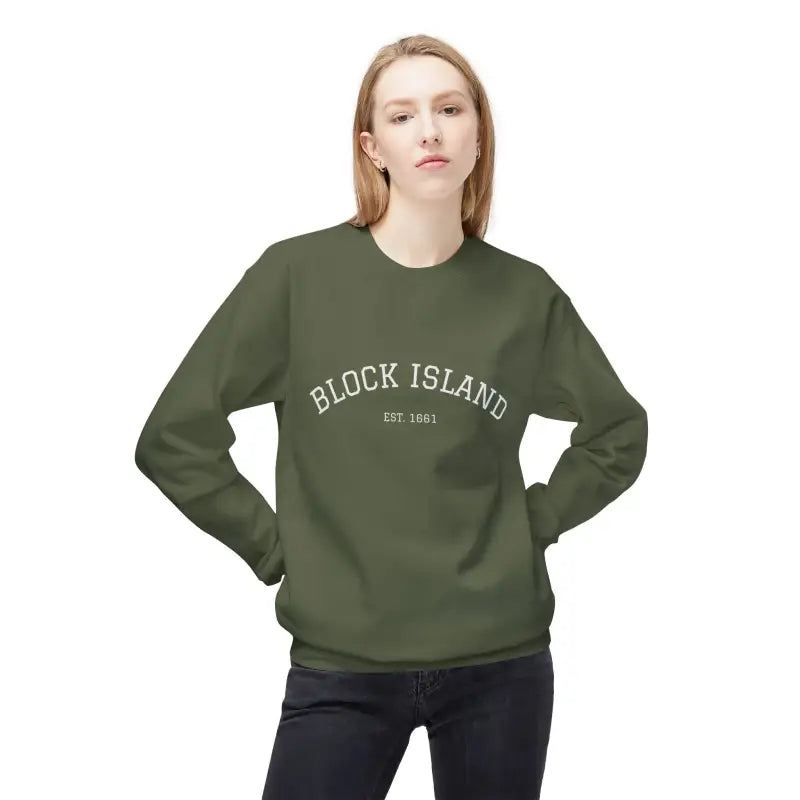 Woman wearing long-sleeved olive green Block Island Crewneck Sweatshirt with printed design