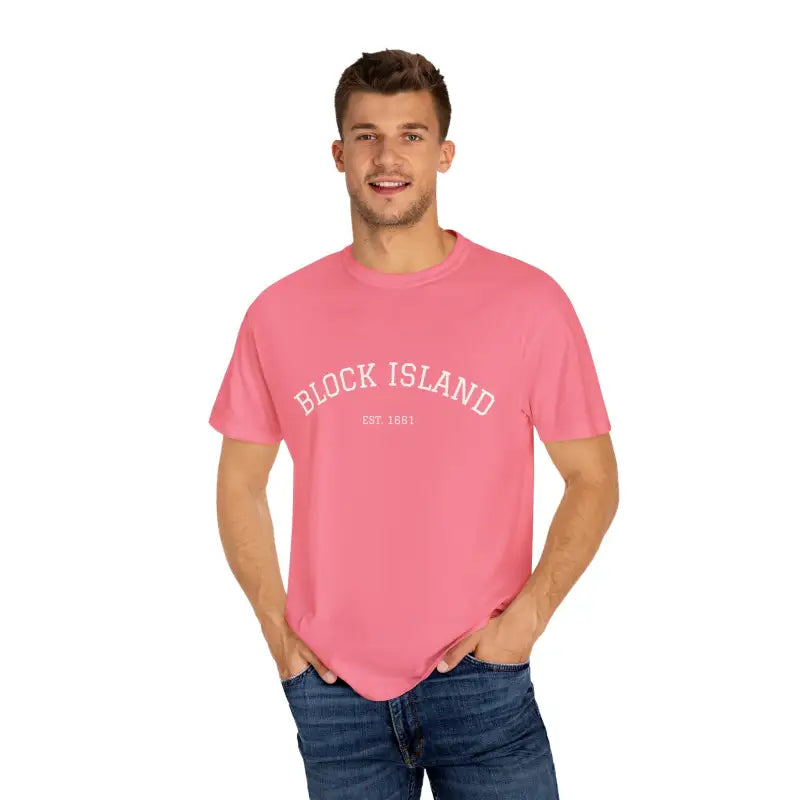 Man wearing pink Block Island Est 1661 short sleeved crewneck T shirt and blue jeans