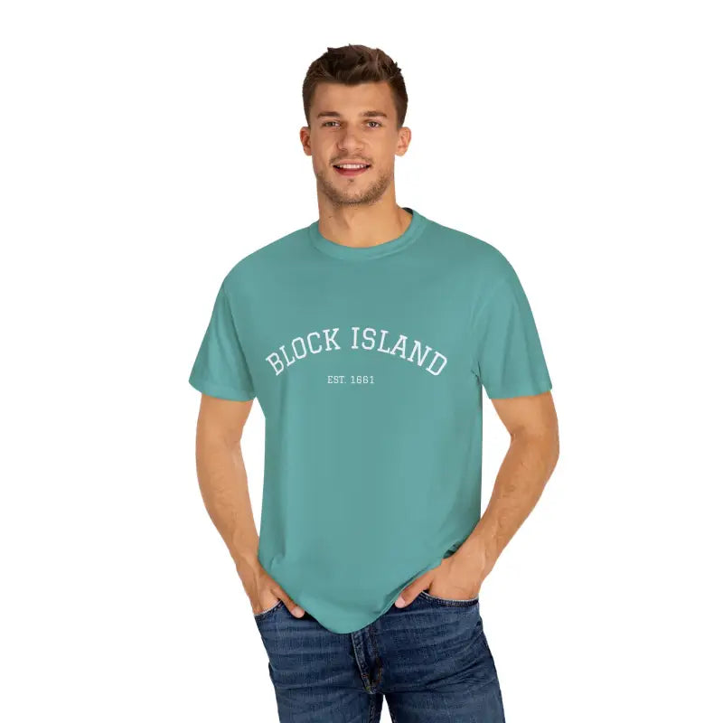 Man wearing teal Block Island Est 1661 short sleeve crewneck t-shirt and blue jeans