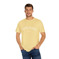 Smiling man wearing a yellow t-shirt and blue jeans in front of Block Island Est 1661 T-shirt display