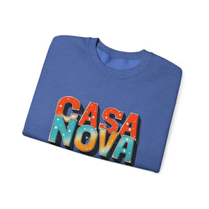 Folded blue Casa Nova crewneck top with colorful starry lettering display