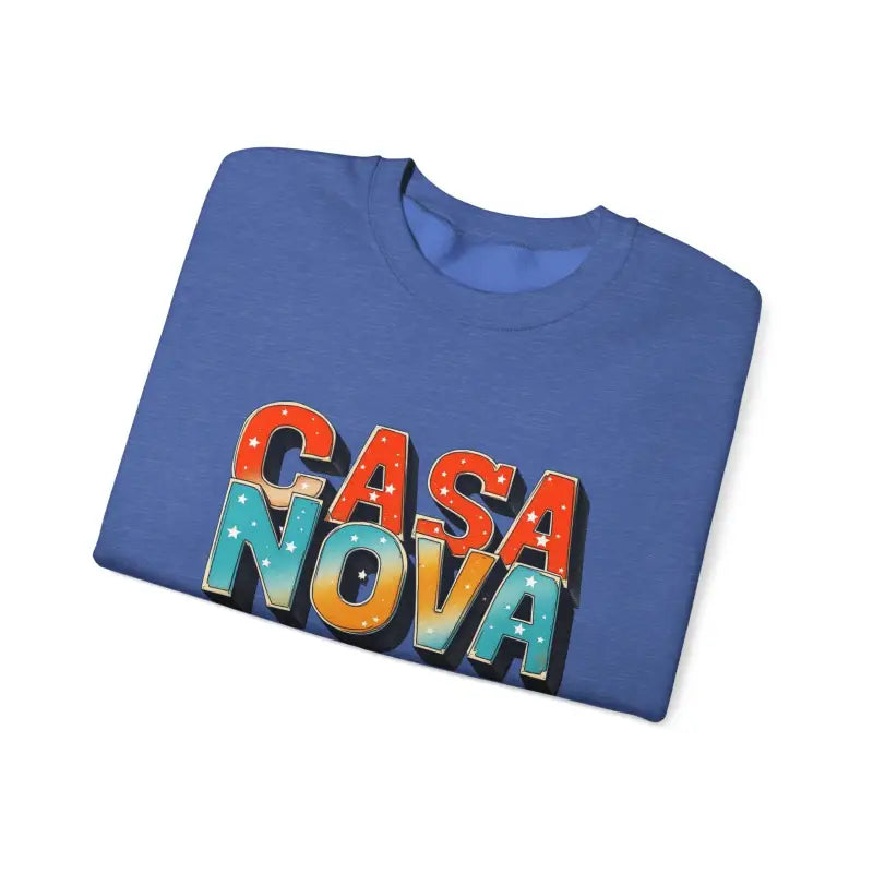 Folded blue Casa Nova crewneck top with colorful starry lettering display