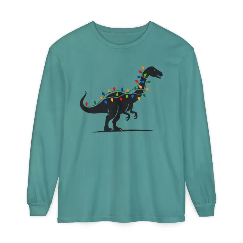 Teal long-sleeved shirt featuring a dinosaur graphic for festive holiday wear