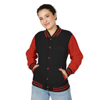 Black varsity jacket with red sleeves, collar, cuffs, hem, snap buttons, and pockets