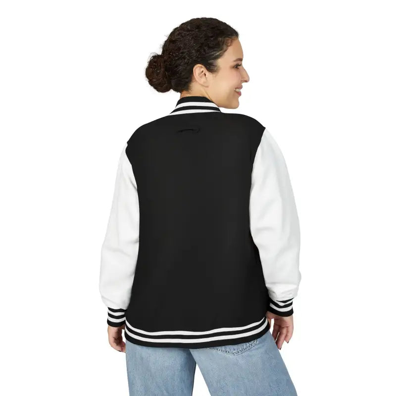 Black and white varsity jacket paired with light blue jeans from Classic Varsity Jacket Collection
