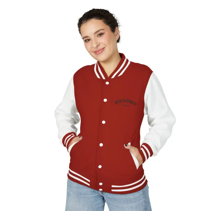 Woman wearing a red and white varsity jacket with WHOLESOME embroidery from Classic Varsity Jacket Collection