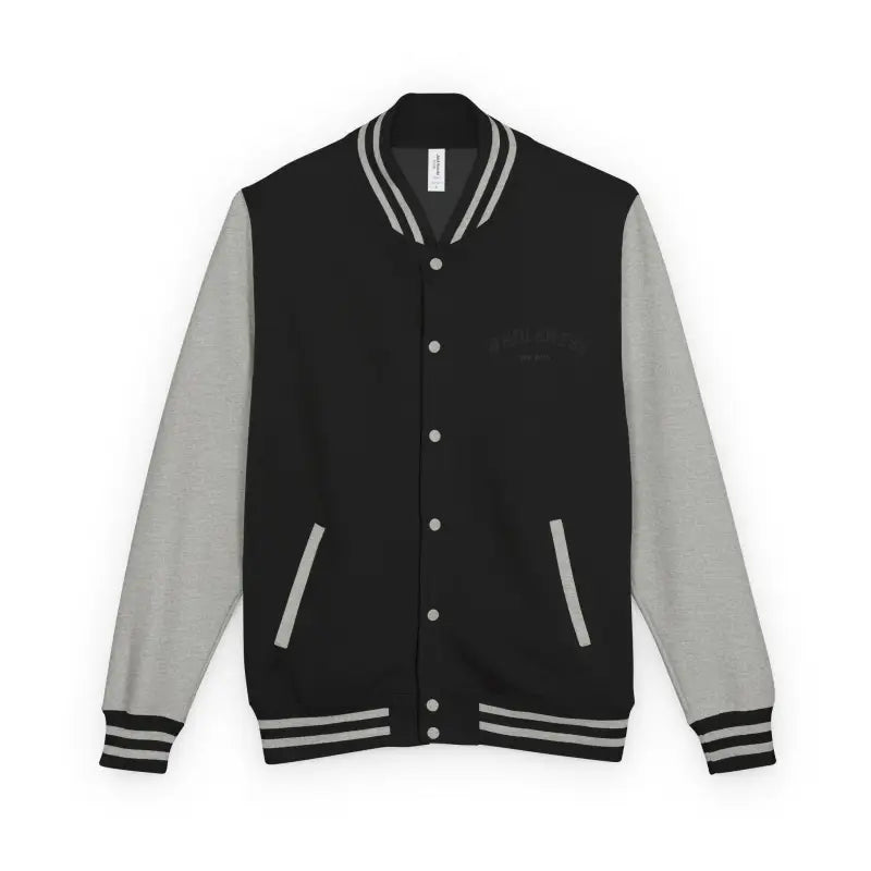 Black varsity jacket with light grey sleeves and white striped collar cuffs and waist