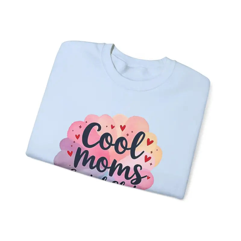 Folded white t-shirt featuring Cool Moms graphic for Cool Moms Social Club collection