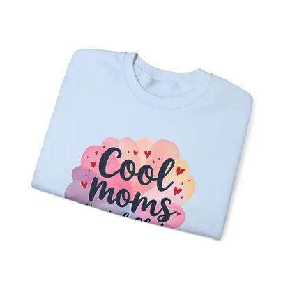 Folded white t-shirt featuring Cool Moms graphic for Cool Moms Social Club collection