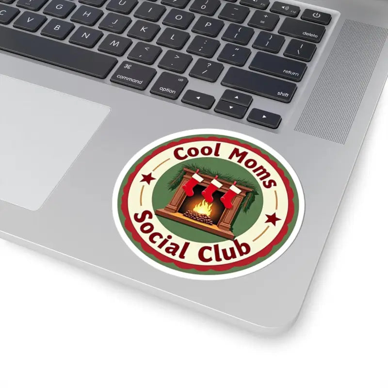 Festive Cool Moms Social Club sticker featuring a cozy fireplace and stockings