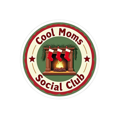 Circular Cool Moms Social Club sticker featuring a cozy fireplace and stockings design