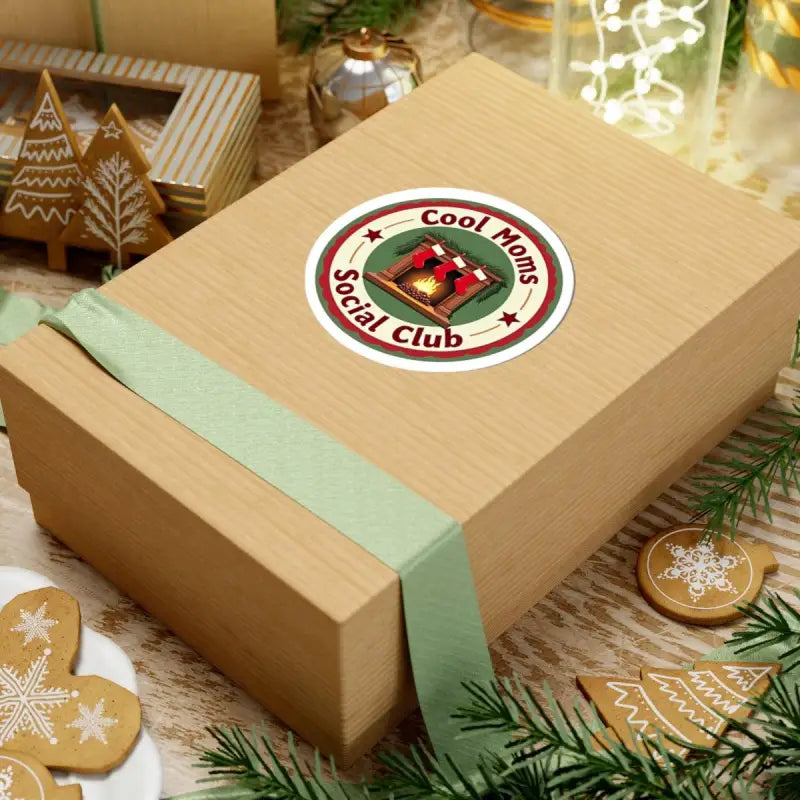 Gift box adorned with Cool Moms Social Club sticker, ideal for holiday celebrations