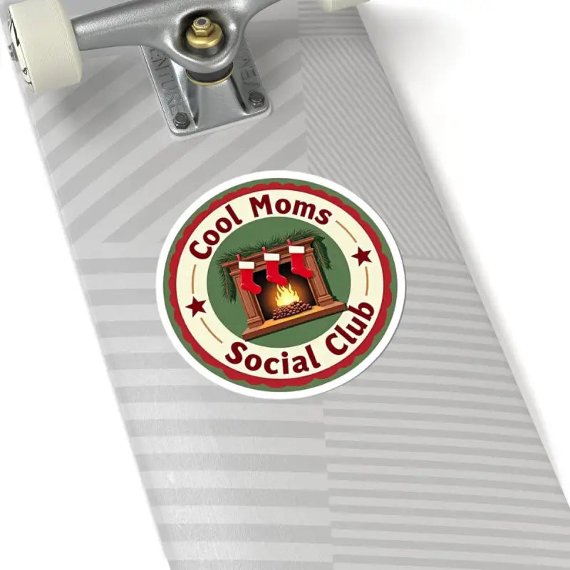Circular sticker featuring a cozy fireplace design for Cool Moms Social Club Holiday collection