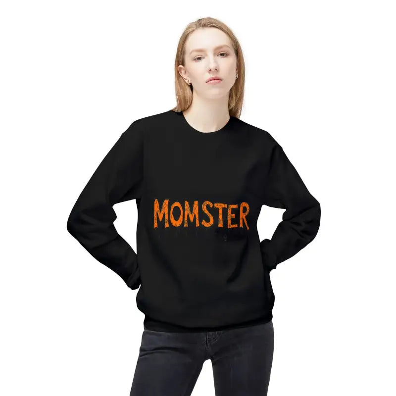Woman wearing a black long-sleeved Crewneck Sweatshirt with MOMSTER dripping letter design