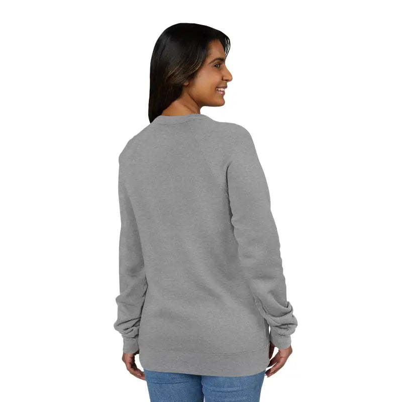 Dark gray crewneck sweatshirt with retro wave graphic paired with blue jeans for women