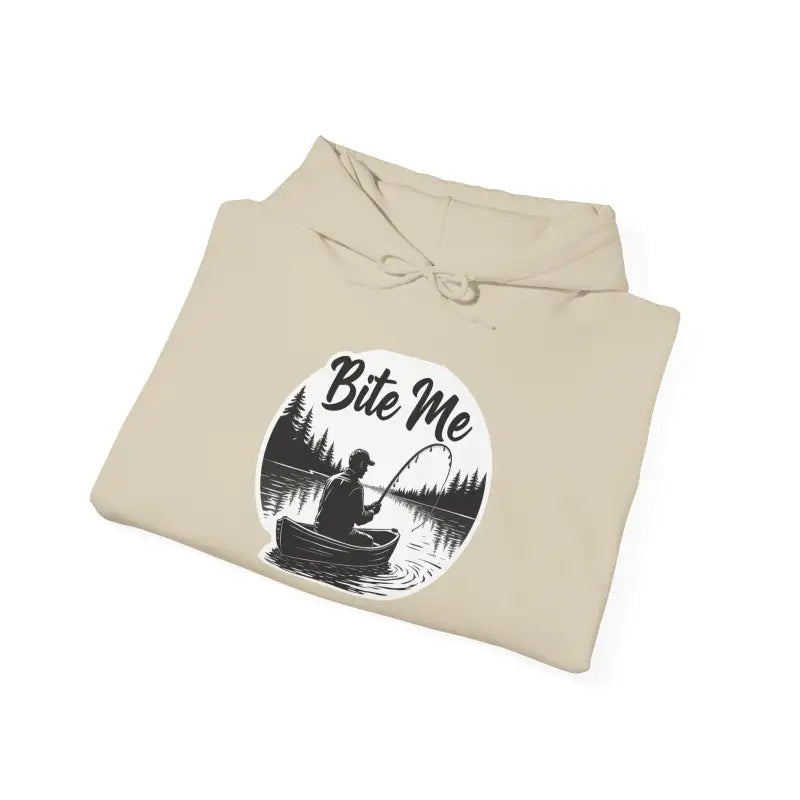 Folded beige Fishing Bite Me Unisex Heavy Blend Hoodie with fishing graphic detail