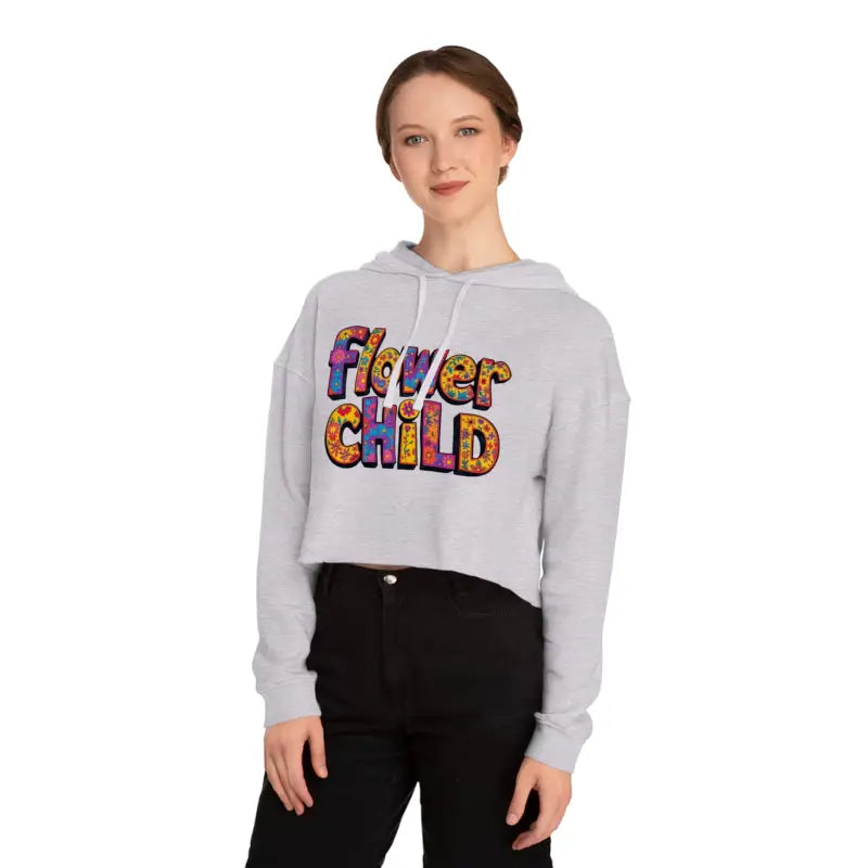 Woman wearing a light gray Flower Child Cropped Hoodie with colorful Flower Child text