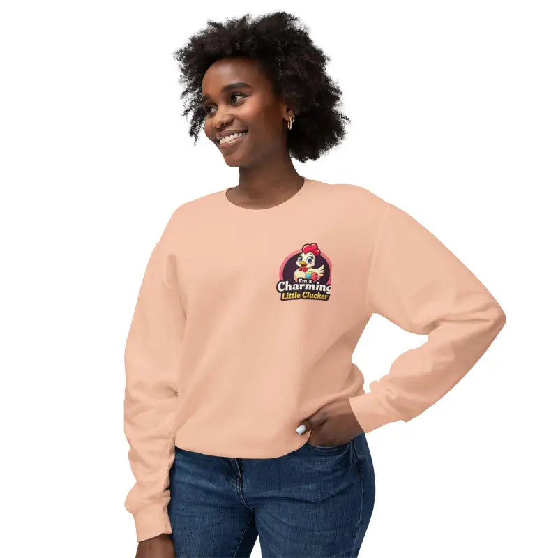 Peach-colored sweatshirt featuring a cartoon chicken logo for women