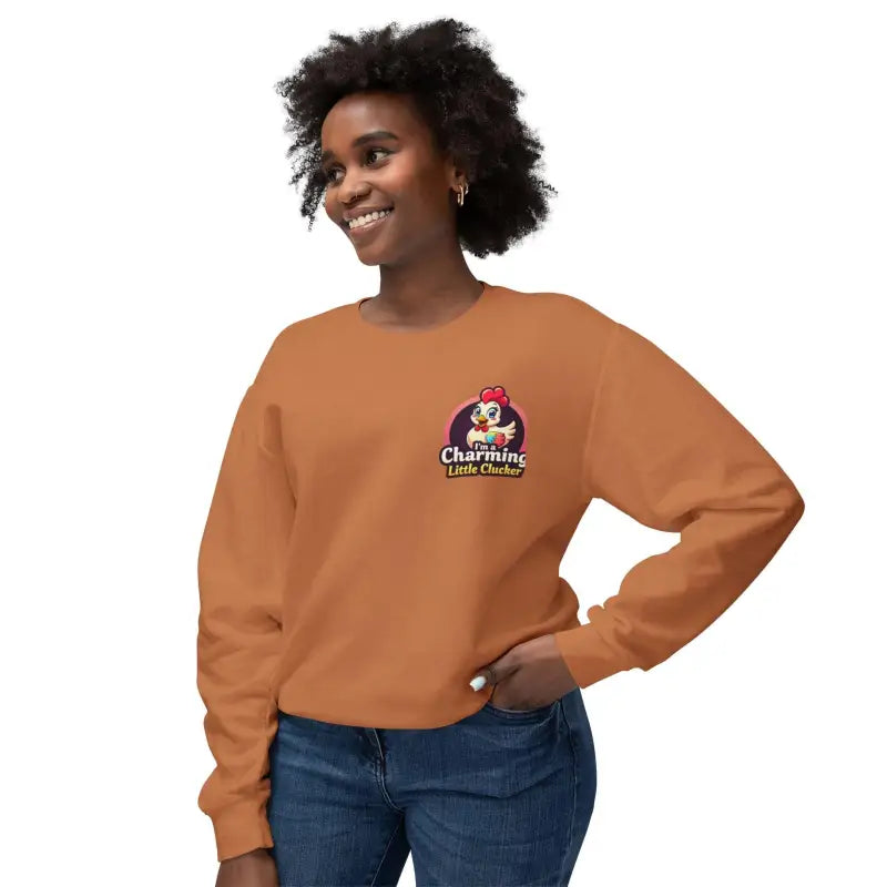 Orange sweatshirt featuring a playful cartoon chicken logo for women