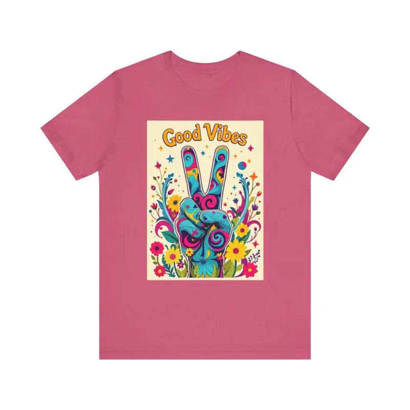Pink t-shirt featuring Good Vibes graphic and colorful peace flower design