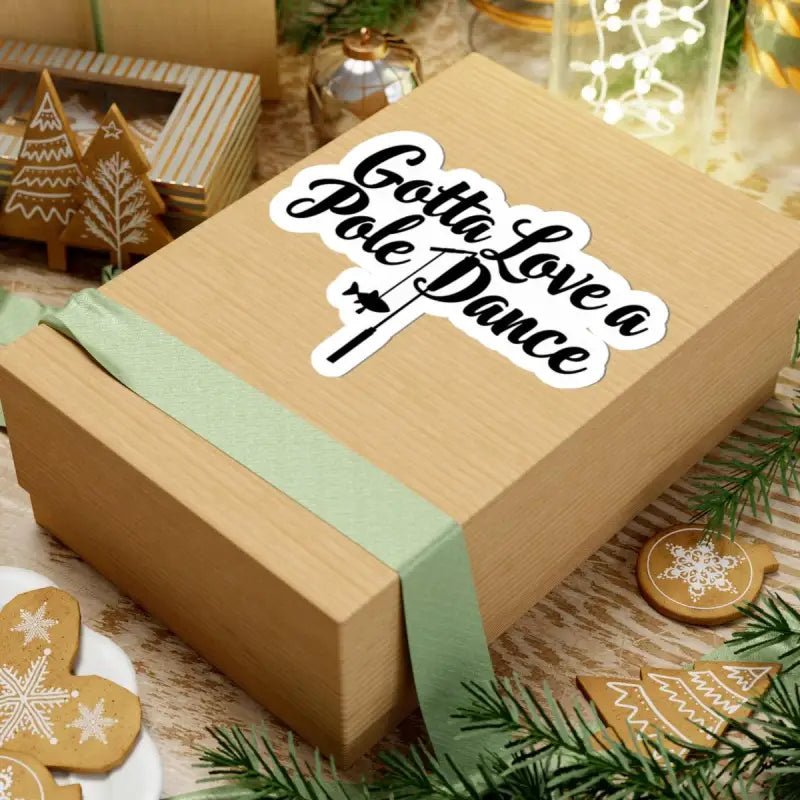Wrapped gift box showcasing the Gotta Love a Pole Dance Fishing Sticker for gifting