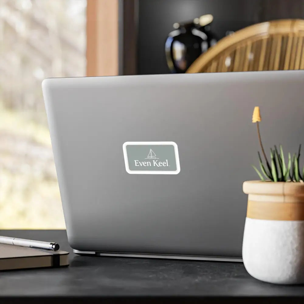 Laptop adorned with a sticker featuring Gray Even Keel Sailboat Sign design