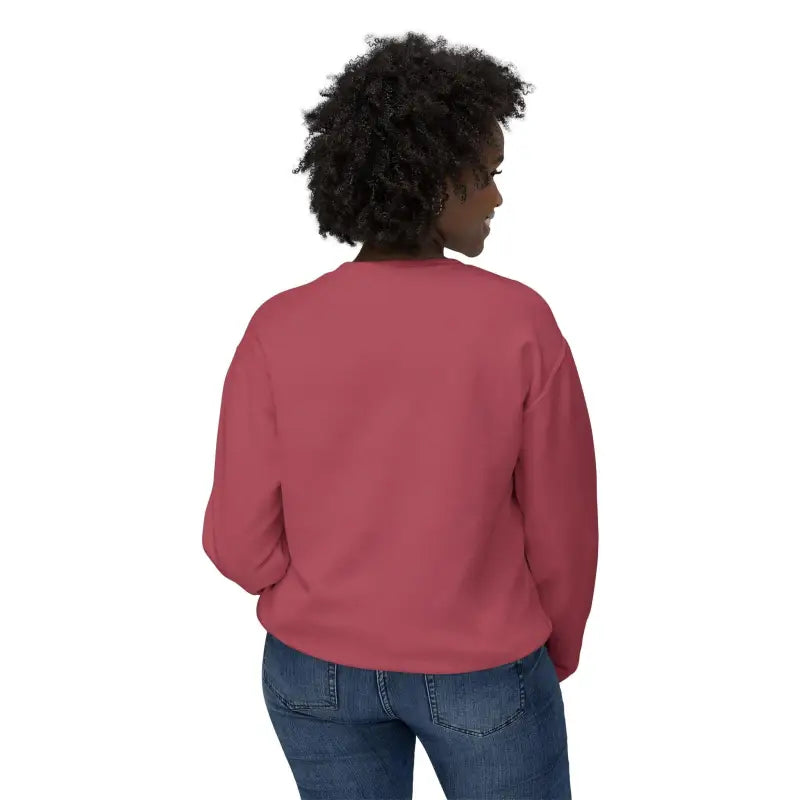 Woman in a red sweatshirt and jeans showcasing the Home Sweet Home Unisex Crewneck