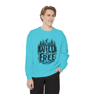 Male model wearing light blue crewneck sweatshirt with nature-themed graphic