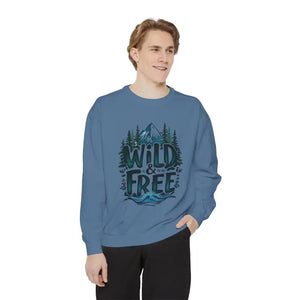 Man wearing light blue gray and white crew neck sweatshirt with Wild and Free graphic