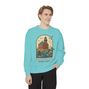 Male model wearing light blue long sleeve crewneck sweatshirt with lighthouse and seagulls graphic