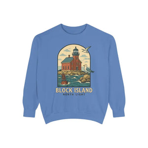 Periwinkle blue long-sleeve crewneck sweatshirt with lighthouse, ocean, and seagull graphic