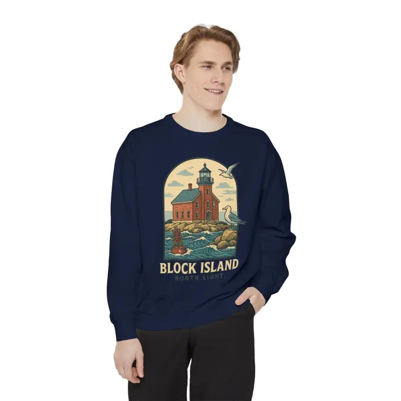 Man wearing navy blue long sleeve crewneck sweatshirt with lighthouse and seagulls graphic